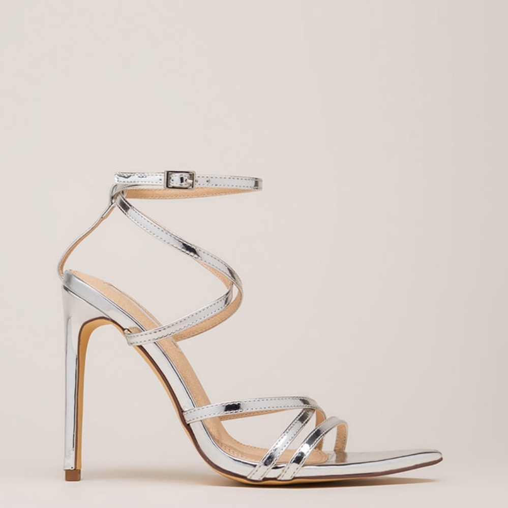 Pointed silver strappy heels.